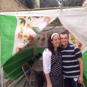 Avi and I outside of our sukkah (hut)